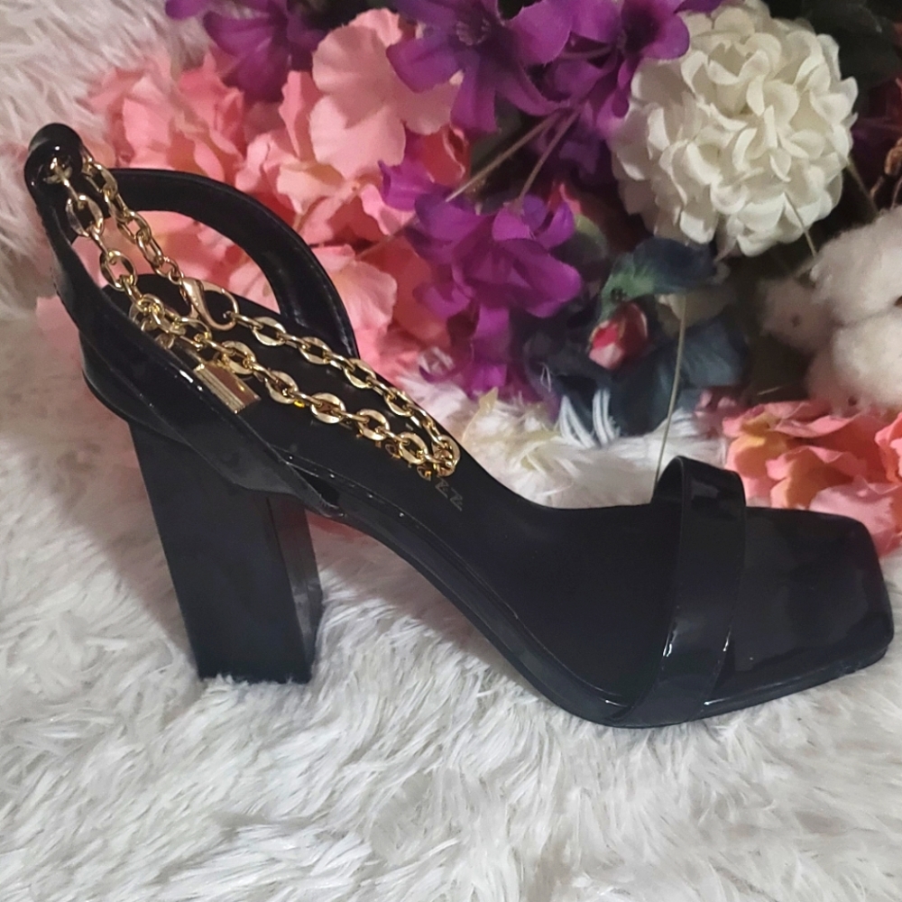 High heels with chain strap.